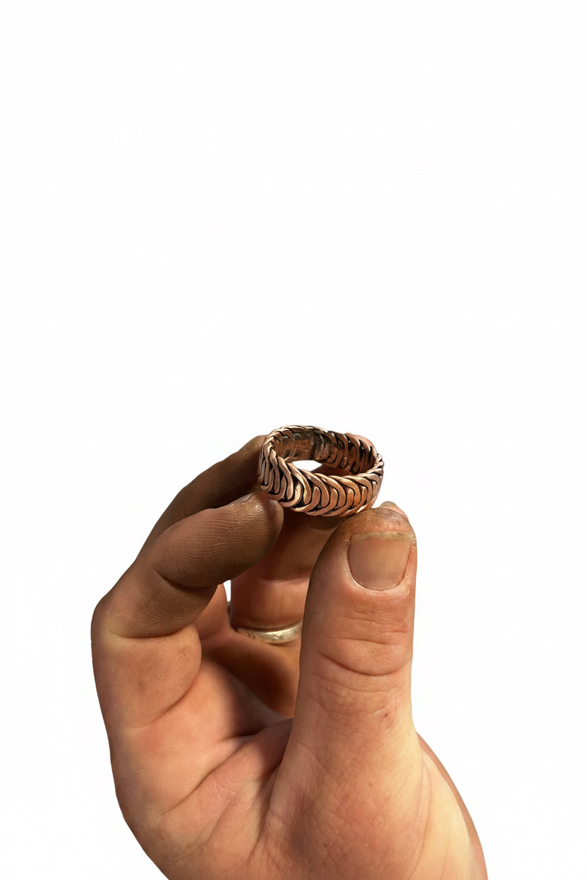 Hand weaving Australian made copper ring.