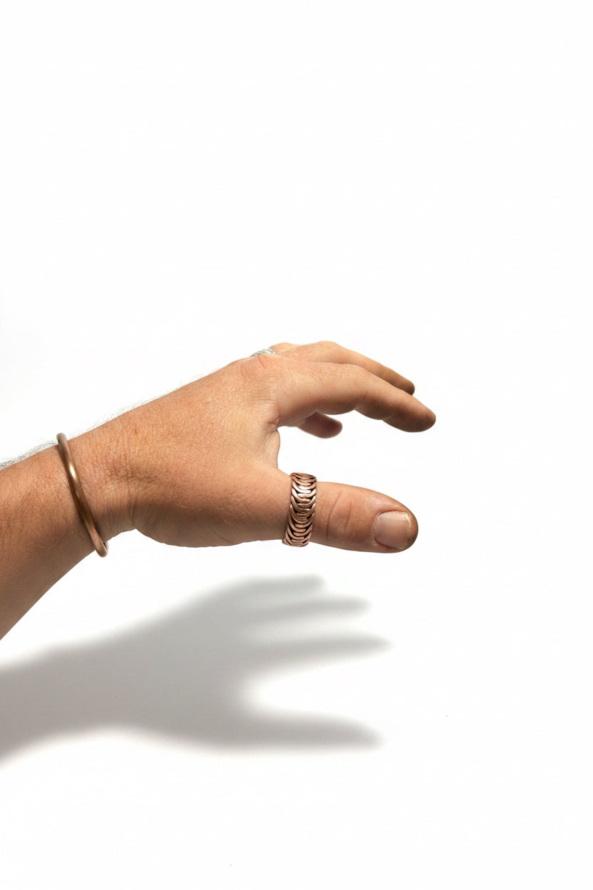 Hand weaving Australian made copper ring.